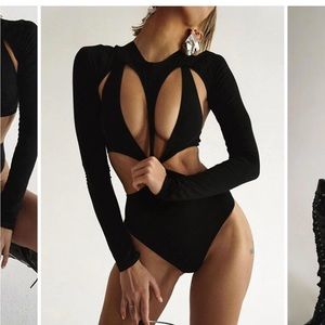 Black bodysuit, Cut-Out Long Sleeve bodysuit. Wearing 1 time for photoshoot.